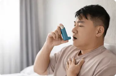 Asthma patient using an inhaler during Primary Care Service Arlington visit