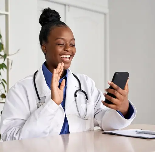 Primary care physician having a telemedicine appointment with a patient on a mobile phone.